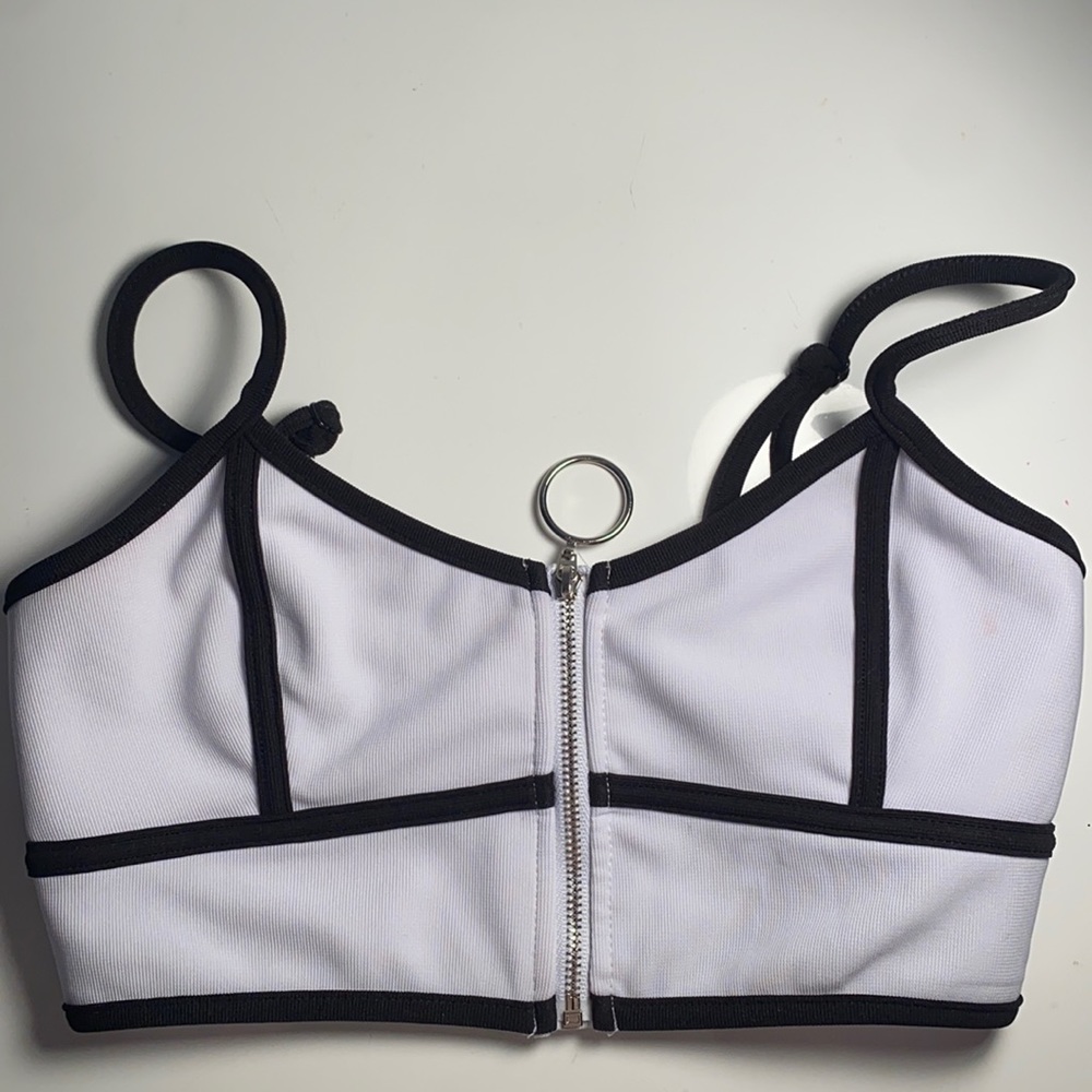 White Zip up top with black trim and lines from LF
